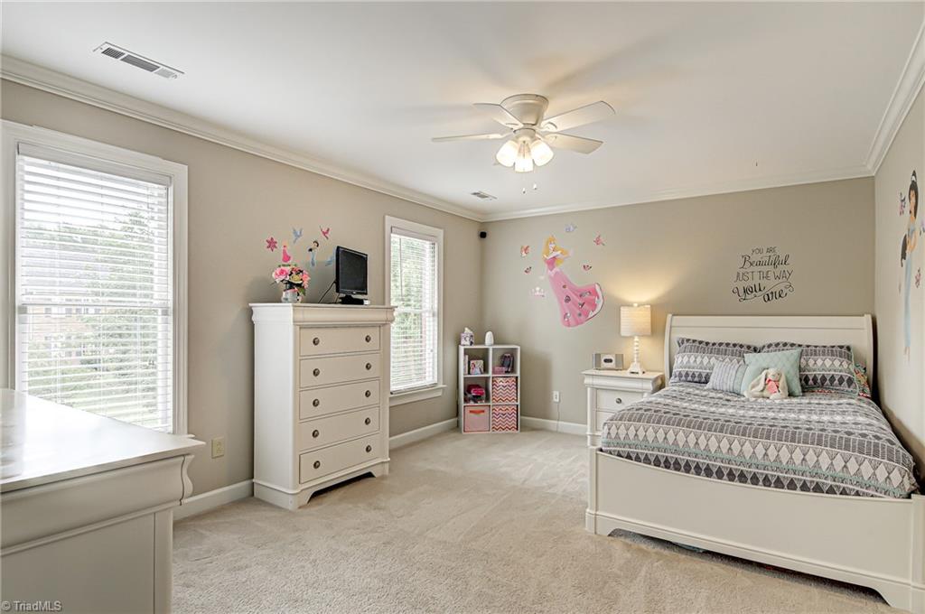 3835 Edgewater Street High Point, NC 27265 - Photo 19 of 30 Bedroom 4 is a large room with carpet, good closet space, crown molding, and lots of natural light.