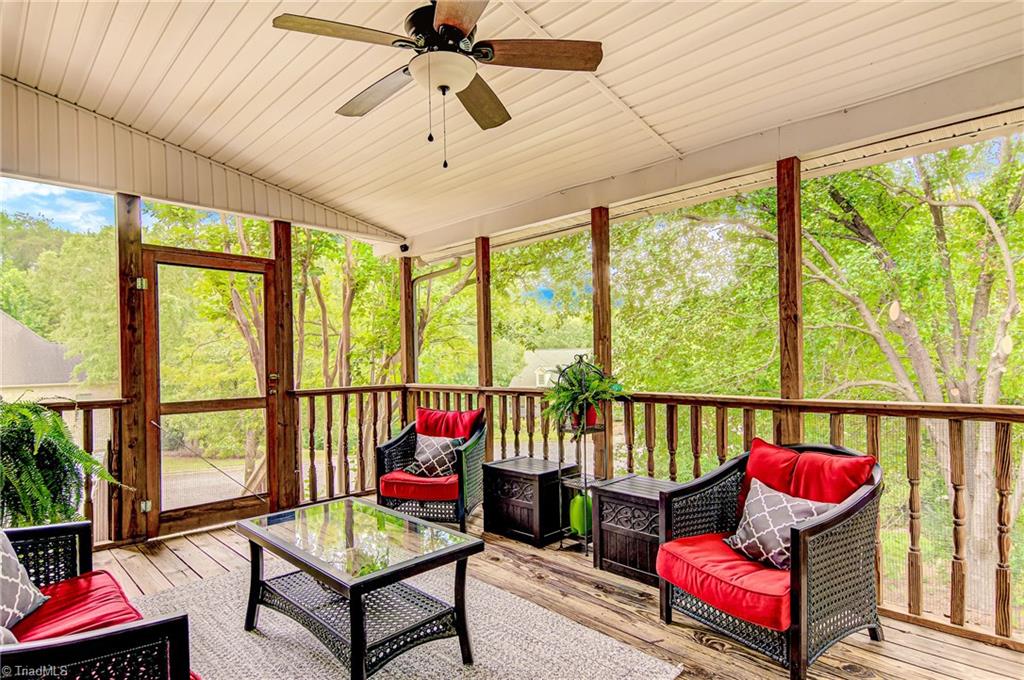 3835 Edgewater Street High Point, NC 27265 - Photo 23 of 30 Relax and enjoy the screened porch with ceiling fan. It is located off the kitchen area and connected to the deck. Both overlooking the wooded backyard.