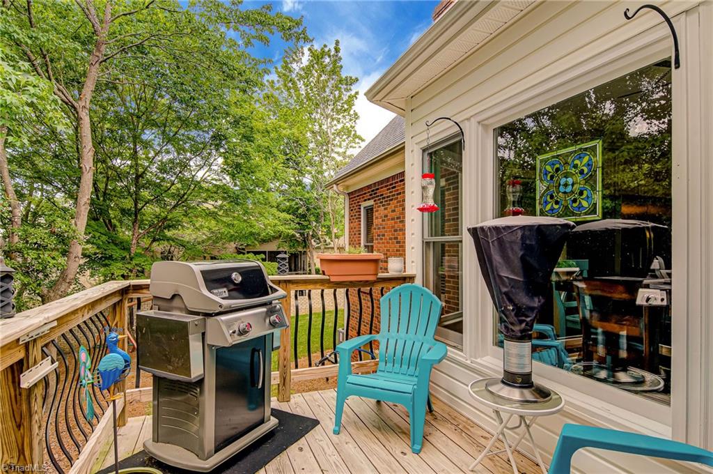 3835 Edgewater Street High Point, NC 27265 - Photo 24 of 30 The deck area off the screened porch was added a couple of years ago to grill and enjoy the backyard.