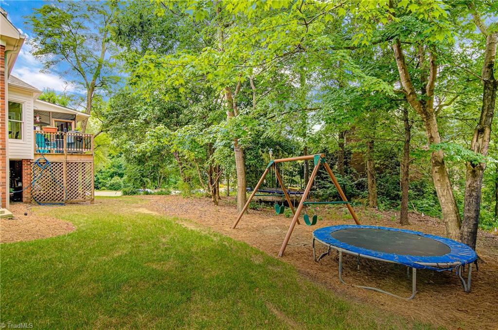 3835 Edgewater Street High Point, NC 27265 - Photo 26 of 30 The backyard is a great entertaining space with many trees to provide privacy and shading.