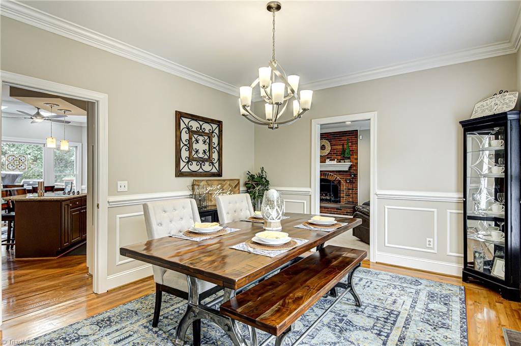 3835 Edgewater Street High Point, NC 27265 - Photo 4 of 30 This formal dining room is nicely sized to host family and friends on those special occasions. The crown molding with chair rail and picture frame wainscoting give the room a classic but comfortable setting.
