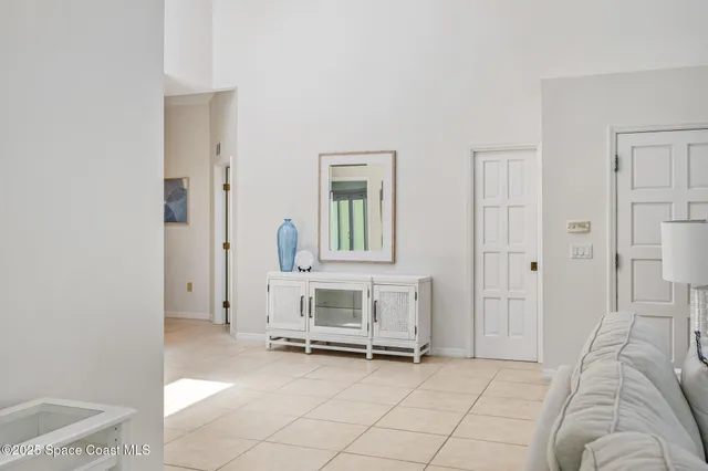 a view of a livingroom with furniture and a window