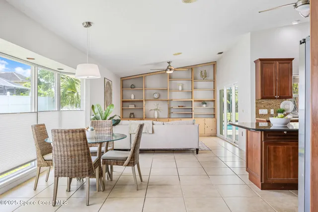 a living room with furniture and large window