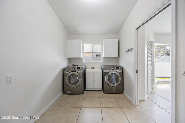 a view of washer and dryer in a utility room