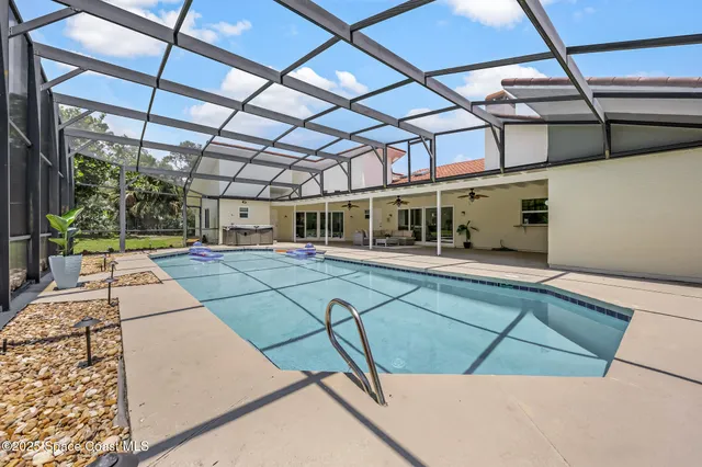 a view of a swimming pool with a patio