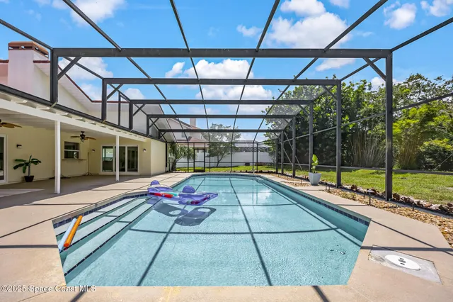 a view of a swimming pool with a lounge chairs