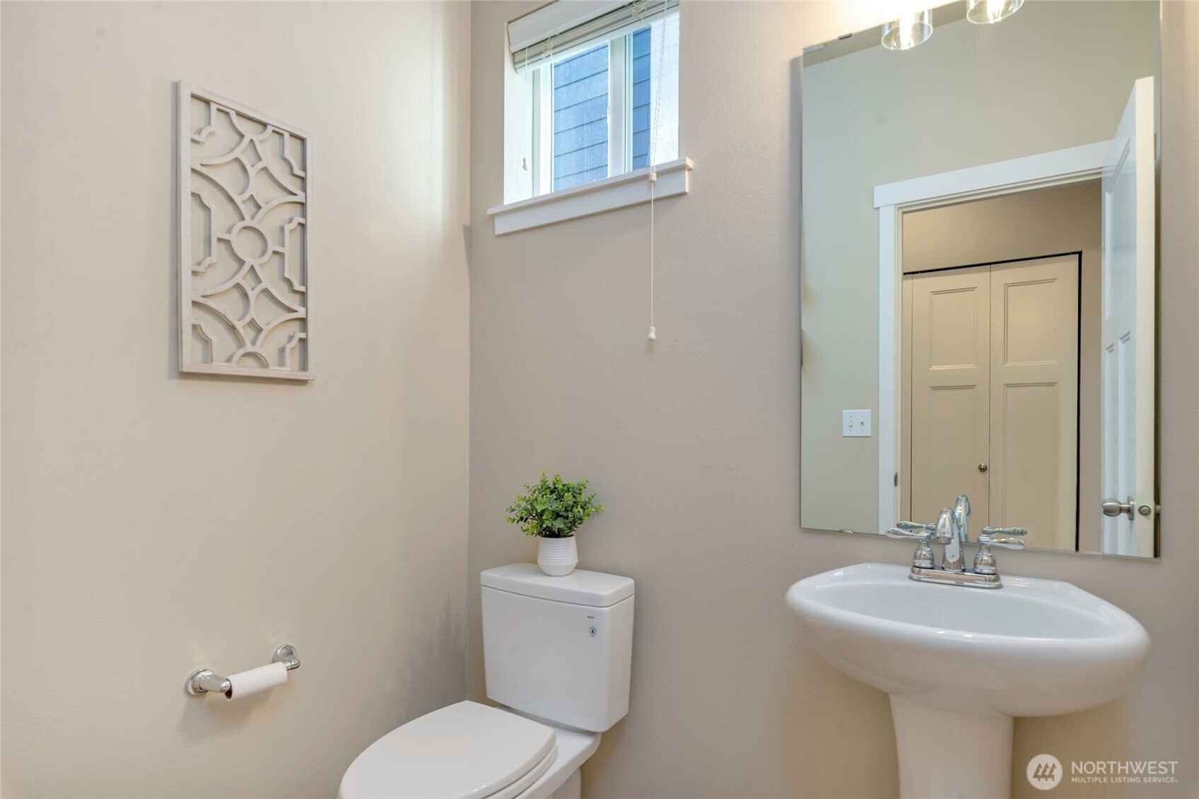 11290 Borgen Loop Northwest Gig Harbor, WA 98332 - Photo 12 of 26 a bathroom with a toilet sink and mirror