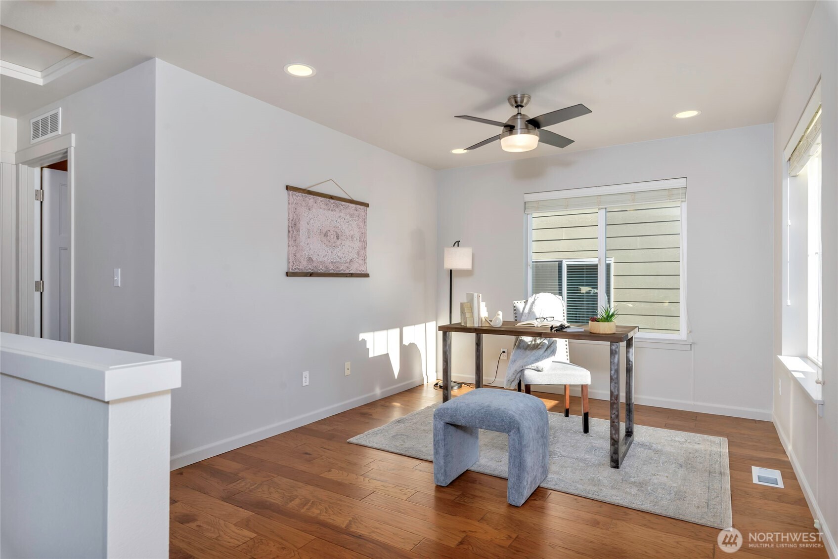 11290 Borgen Loop Northwest Gig Harbor, WA 98332 - Photo 13 of 26 a living room with furniture and a window