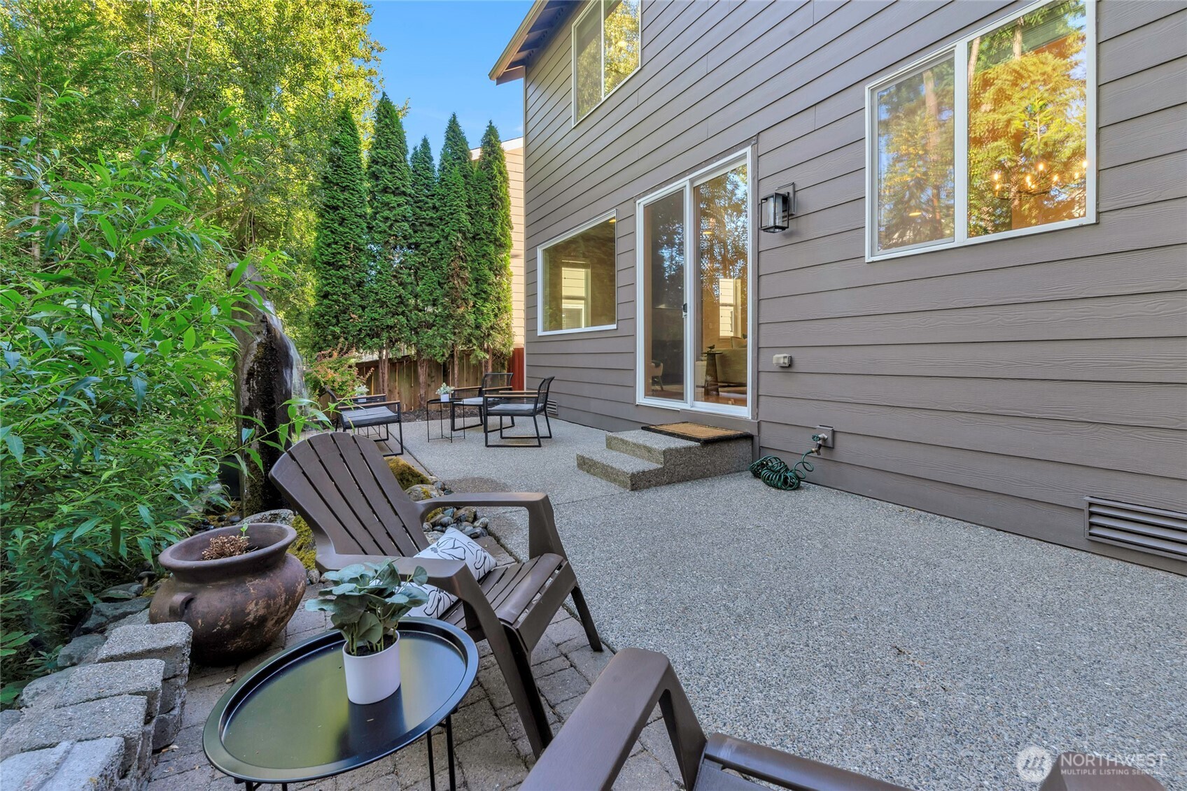 11290 Borgen Loop Northwest Gig Harbor, WA 98332 - Photo 26 of 26 a view of backyard of house with seating space