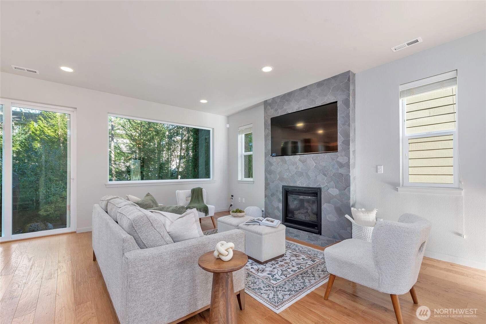 11290 Borgen Loop Northwest Gig Harbor, WA 98332 - Photo 6 of 26 a living room with furniture fireplace and window