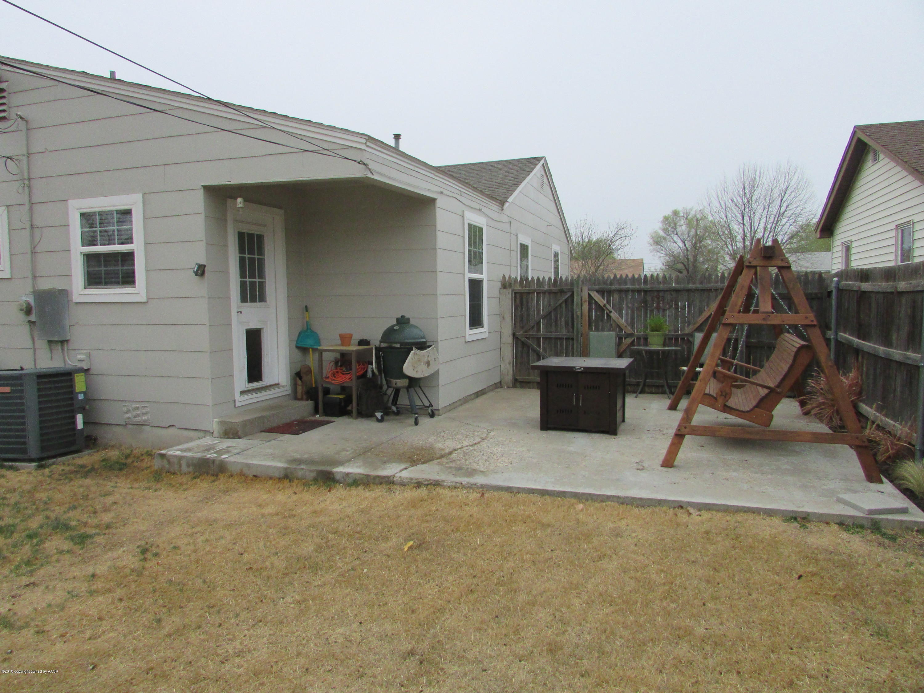 4605 South Travis Street Amarillo, TX 79110 - Photo 17 of 17 a view of a patio with table and chairs