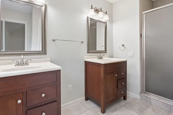 a bathroom with a sink and mirror