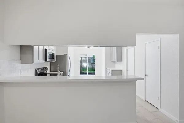 a view of a living room and entry way