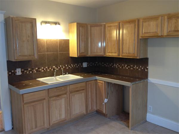 20-22 Standish Street Springfield, MA 01108 - Photo 11 of 27 a kitchen with a sink and cabinets