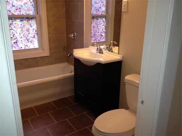 20-22 Standish Street Springfield, MA 01108 - Photo 13 of 27 a bathroom with a sink toilet and shower
