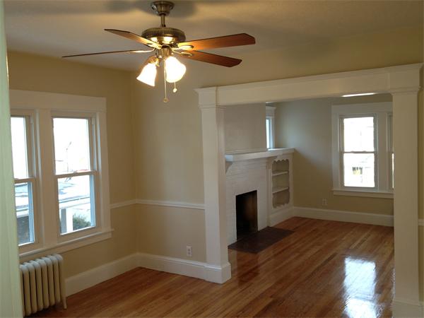 20-22 Standish Street Springfield, MA 01108 - Photo 14 of 27 a view of an empty room with wooden floor and a window