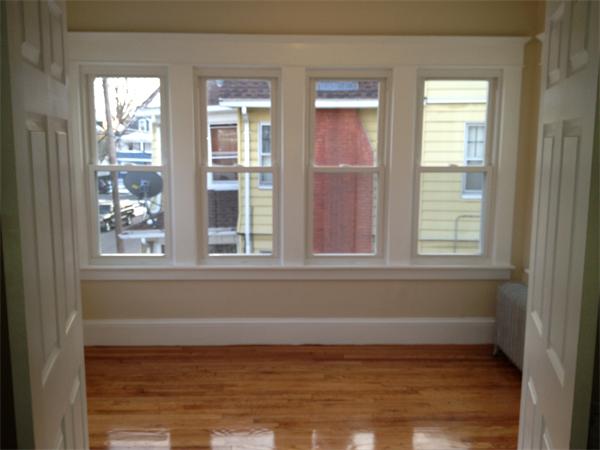 20-22 Standish Street Springfield, MA 01108 - Photo 15 of 27 a view of empty room with wooden floor and fan