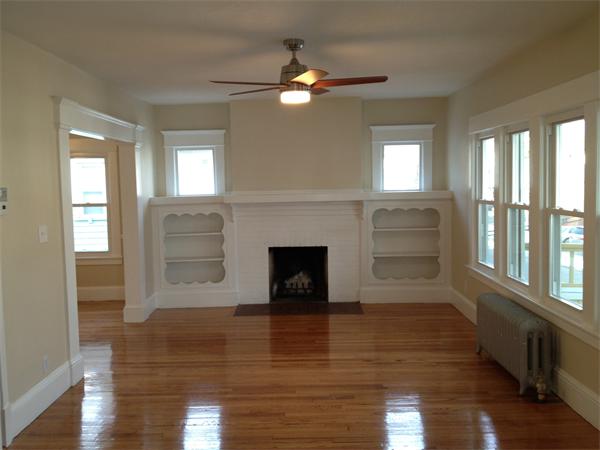 20-22 Standish Street Springfield, MA 01108 - Photo 16 of 27 a living room with furniture and a fireplace