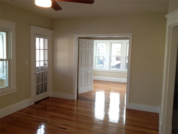 20-22 Standish Street Springfield, MA 01108 - Photo 17 of 27 a view of empty room with wooden floor and fan
