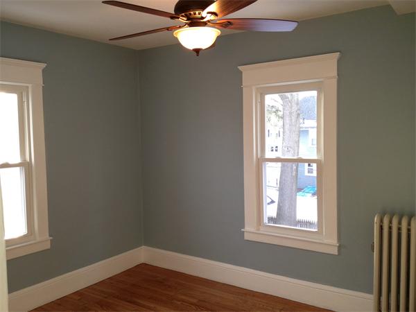 20-22 Standish Street Springfield, MA 01108 - Photo 19 of 27 an empty room with wooden floor windows and fan