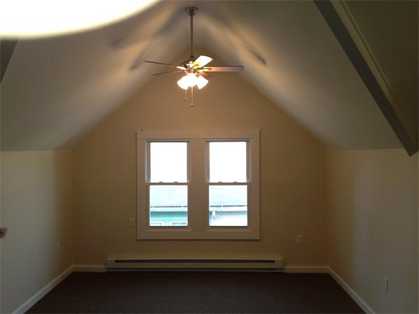 20-22 Standish Street Springfield, MA 01108 - Photo 22 of 27 wooden floor in an empty room with a window
