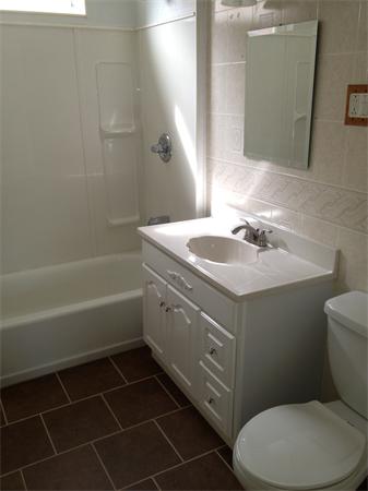 20-22 Standish Street Springfield, MA 01108 - Photo 4 of 27 a bathroom with a sink toilet and shower