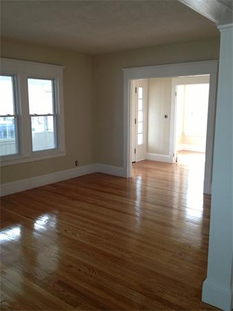 20-22 Standish Street Springfield, MA 01108 - Photo 8 of 27 a view of an empty room with wooden floor and a window