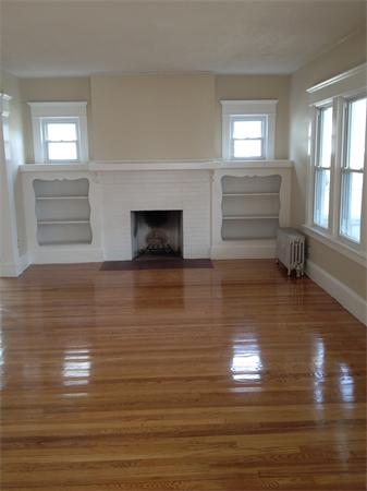 20-22 Standish Street Springfield, MA 01108 - Photo 9 of 27 a view of empty room with wooden floor and fan