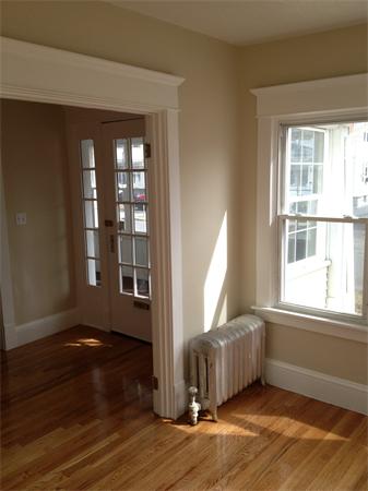 20-22 Standish Street Springfield, MA 01108 - Photo 10 of 27 an empty room with wooden floor and windows