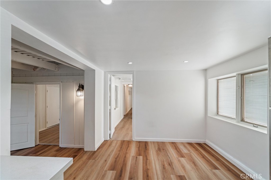 44270 Arya Court Anza, CA 92539 - Photo 11 of 64 a view of hallway with a large window and wooden floor