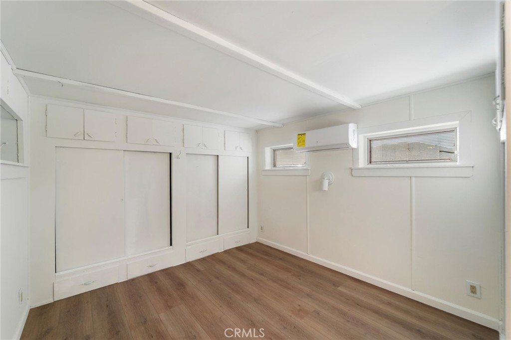 44270 Arya Court Anza, CA 92539 - Photo 13 of 64 a view of an empty room with wooden floor and a window