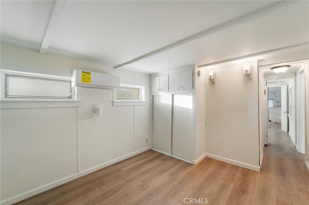 44270 Arya Court Anza, CA 92539 - Photo 14 of 64 a view of an empty room with wooden floor and a window