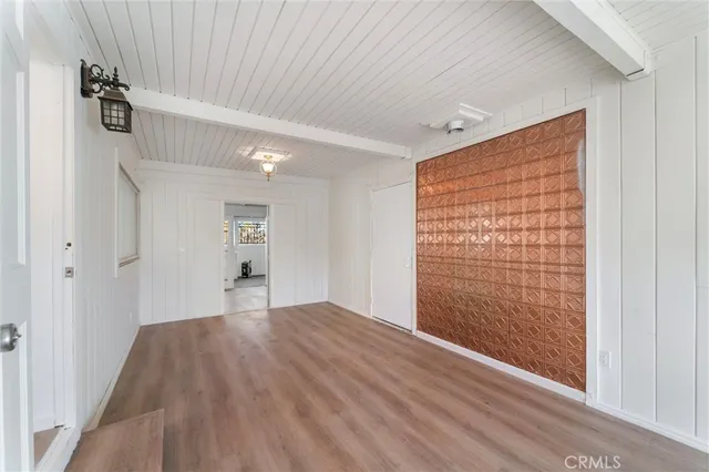 a view of wooden floor and windows in a room