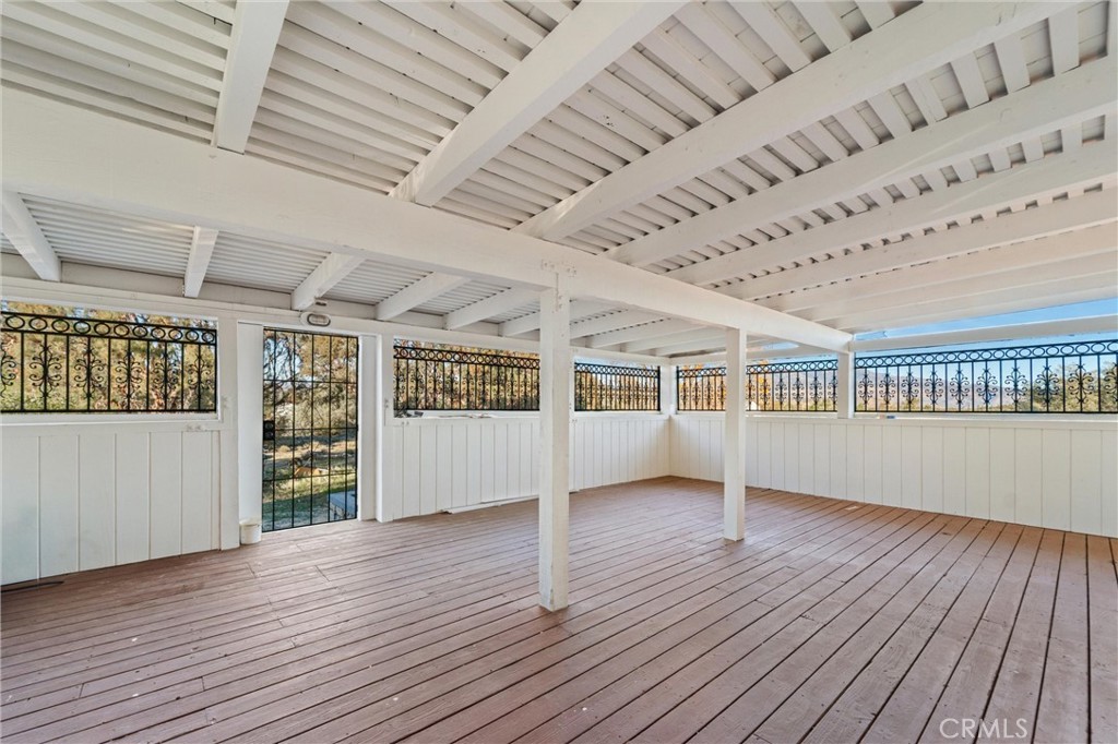 44270 Arya Court Anza, CA 92539 - Photo 29 of 64 a view of an empty room with wooden floor and a window