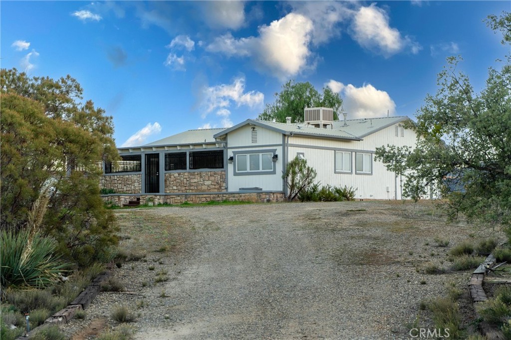 44270 Arya Court Anza, CA 92539 - Photo 3 of 64 front view of a house with a yard