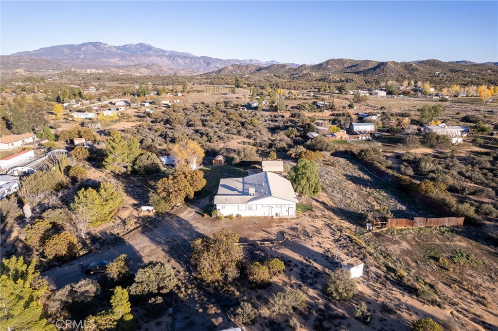 44270 Arya Court Anza, CA 92539 - Photo 46 of 64 an aerial view of residential house with parking and mountain view