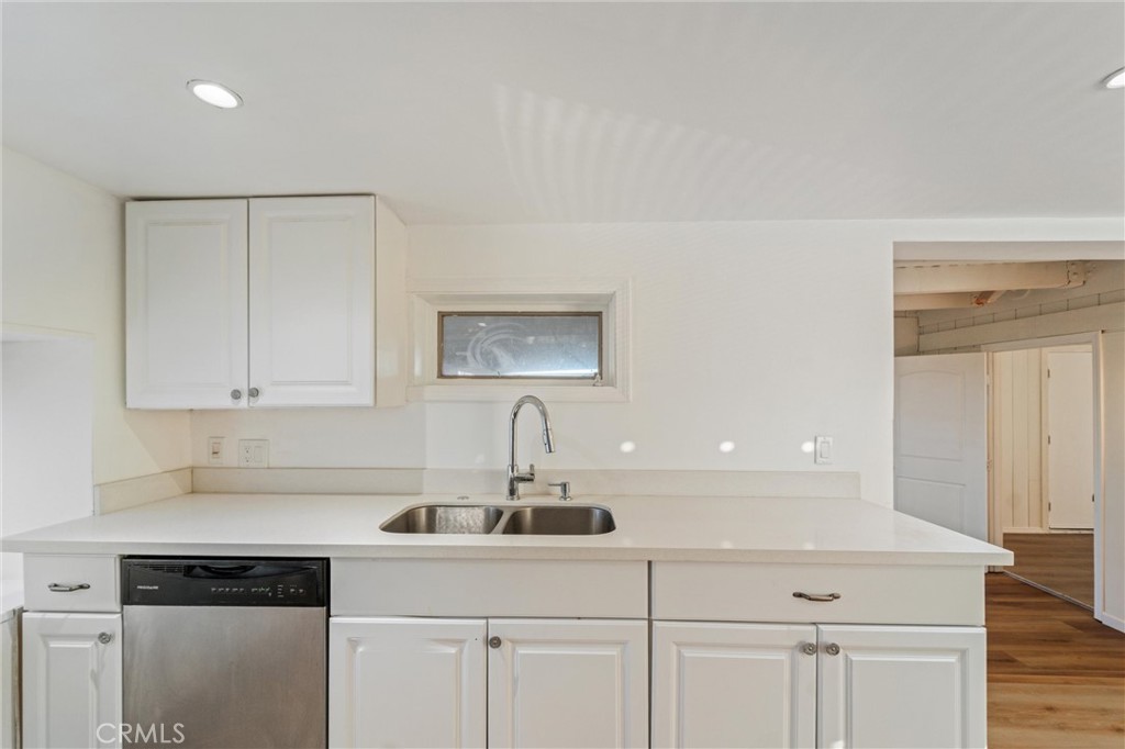 44270 Arya Court Anza, CA 92539 - Photo 10 of 64 a kitchen with white cabinets and a sink