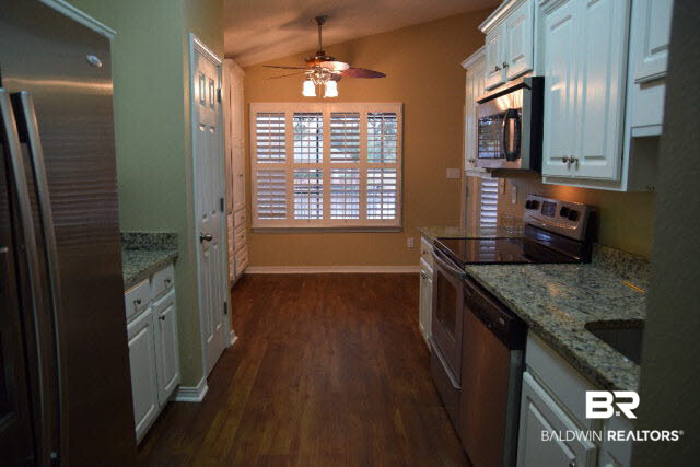 229 Spring Lake Drive Fairhope, AL 36532 - Photo 5 of 21 Great Kitchen with Granite and Stainless Steel appliances including the double door refrigerator.
