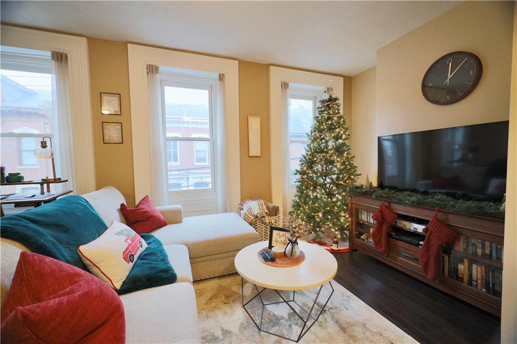 515 Lockhart Street, Unit 3 Pittsburgh, PA 15212 - Photo 6 of 27 a living room with furniture and a flat screen tv