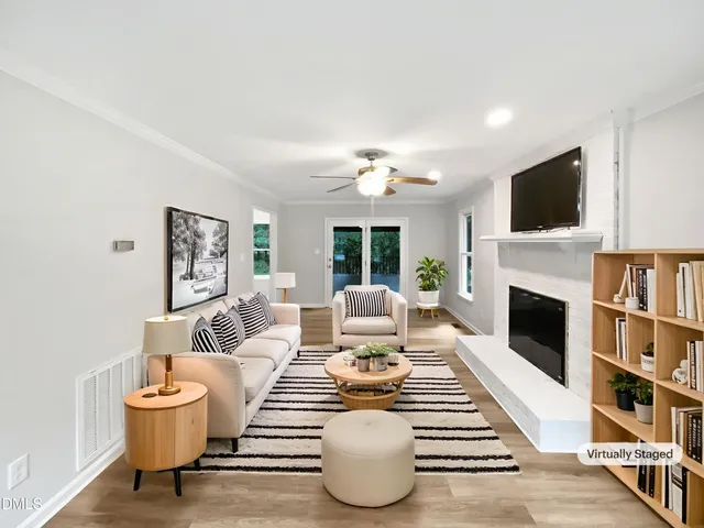 a living room with furniture and a fireplace