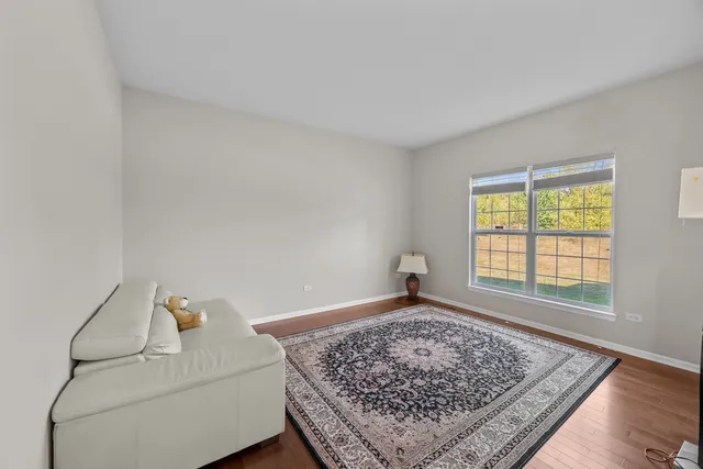 a living room with a couch and a rug