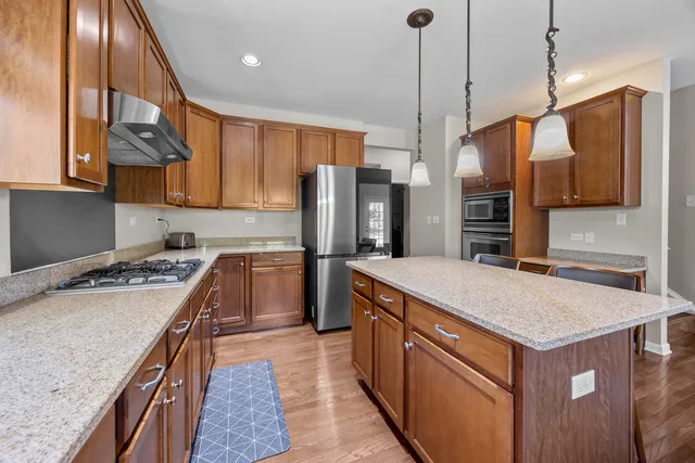 a kitchen that has a lot of cabinets in it