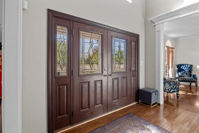 a view of a livingroom with furniture and front door
