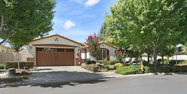 a view of a room with wooden floor and windows