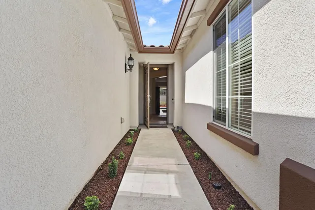 a view of a backyard of the house