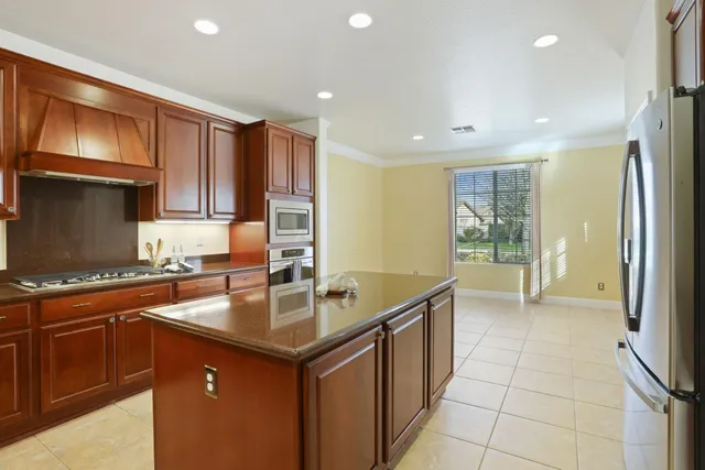 an empty room with wooden floor and fireplace