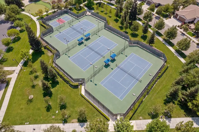 a view of a lake with a house in the background