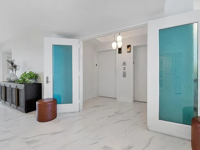 a view of empty room with a potted plant