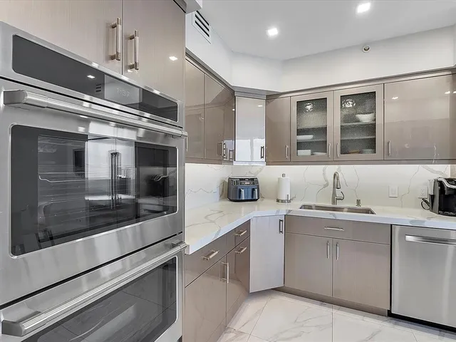 a kitchen with a sink and cabinets
