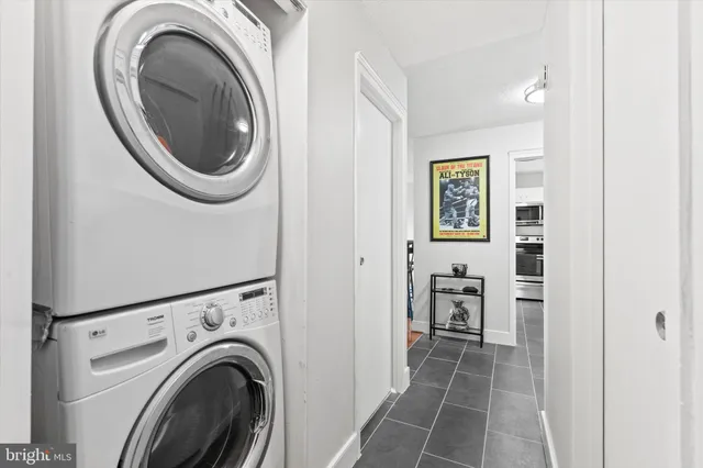 a view of a hallway with washer and dryer